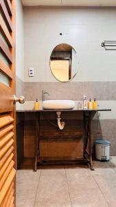 a bathroom with a sink and a mirror at Leranda Bonita in Hue +43 photos