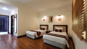 a hotel room with two beds in a room at Dong Khanh Hotel in Ho Chi Minh City +54 photos