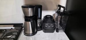 a coffee maker and a blender on a counter at Modern Industrial Artsy Apt Remodel Secure in Matamoros