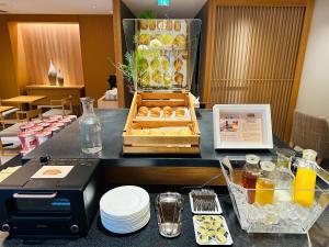 a table with a tray of pastries on it at KIORI Collection Shinmachi in Kyoto