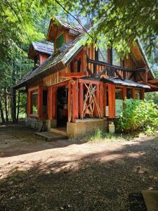 a log cabin in the middle of a forest at Brisas del llaima in Melipeuco