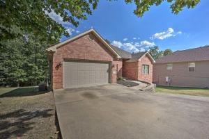 a brick house with a garage at The Hub in Bella Vista