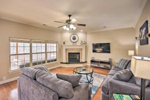 a living room with two couches and a fireplace at The Hub in Bella Vista