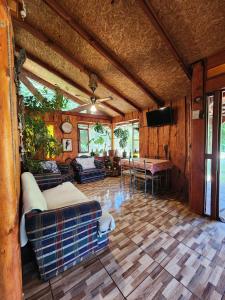 a living room with a couch and a table at Brisas del llaima in Melipeuco