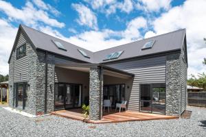 a modern house with a gambrel roof at 44b Scarborough Terrace in Hanmer Springs
