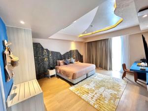 a hotel room with a bed and a couch at Solea Mactan Resort and Waterpark in Mactan +112 photos