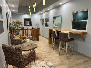 a living room with a table and chairs at BethsAida Conference Center & Boutique Accommodations in Simpson Bay