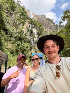 a group of people standing in front of a mountain at Thomasha Homestay Wellawaya in Wellawaya +12 photos