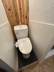 a small bathroom with a toilet and a sink at TomaReno Beppu-Kitahama in Beppu +17 photos