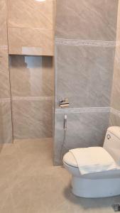 a bathroom with a toilet and a shower at Skyview Hotel in Ban Donsôm Tai +24 photos