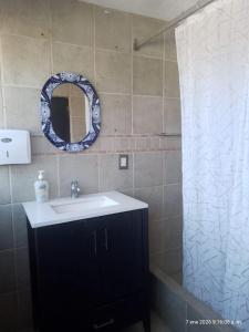 a bathroom with a sink and a mirror at Casa El nido de las flores in Oaxtepec +18 photos