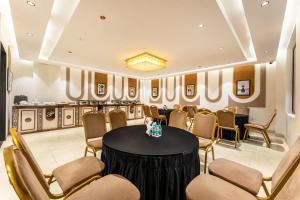 a meeting room with a round table and chairs at Treebo Premium Landmark Prayagraj in Prayagraj