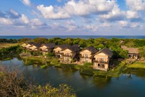 an aerial view of a resort on a river at Jungle Beach an Uga Experience - Trincomalee in Trincomalee