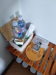 a table with two bottles of water on it at Motel NHÀ SAM in áº¤p VÄ©nh ÃÃ´ng