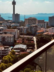 a view of a city from a balcony at Sea View Studio in Pattaya South