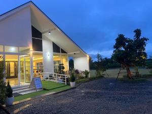 a house with a sign in front of it at เพาะสุข กู๊ดดรีม in Ban Wang Hu Kwang +13 photos