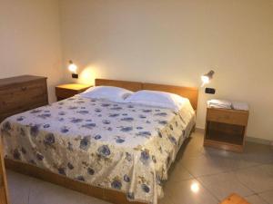 Postel nebo postele na pokoji v ubytování Hotel Apollo