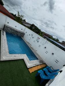 an overhead view of a swimming pool in a building at Ujang Guest House in Batu Kikir