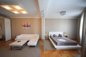 Llit o llits en una habitació de Garni Uni Elita Lux Hotel