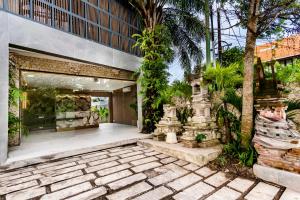 an exterior view of a house with a patio at Anoya Boutique Villa in Kerobokan