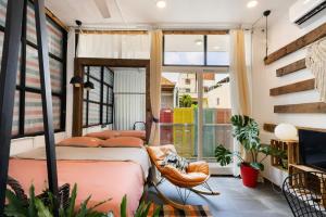 a bedroom with two beds and a window at StayX Central Suites Q1 in Ho Chi Minh City