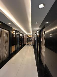 a long hallway with a row of lockers at Faerydae Suites - Free Pool Access in Manila