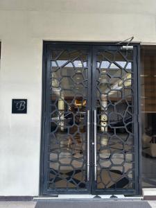 a door to a store with a rack of masks at Faerydae Suites - Free Pool Access in Manila +9 photos