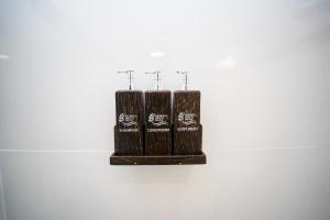 two black candles are hanging on a wall at Moringa Beach in Mirissa
