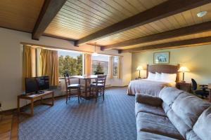 a hotel room with a bed and a couch at Westcliff Lodge in Hood River