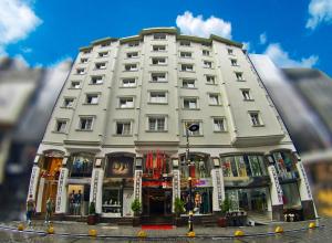 a large white building with a lot of windows at Gold Hotel in Istanbul