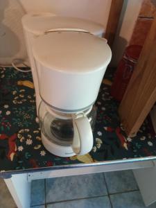 a toilet sitting on a table in a bathroom at Ti caze memé étage in Saint-Philippe +18 photos