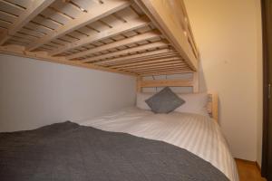 a bed in a room with a bunk bed at Rojuman Hakata in Hakata