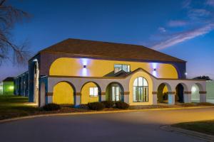 a large building with lights on top of it at Days Inn by Wyndham Austin in Austin