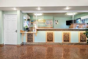 a room with a counter and a white door at Howard Johnson by Wyndham Pasadena in Pasadena