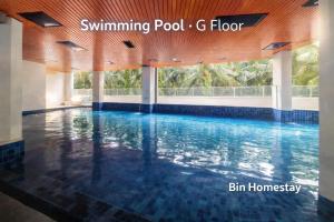 a swimming pool g floor in a house at Starlight Homestay The Venus Sitiawan in Seri Manjung +26 photos