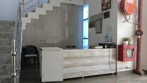 a counter in a room with a staircase at Nirmala Garden in Bamiana
