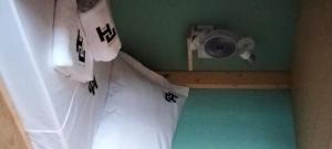 a room with rolls of toilet paper on the wall at Urban Hostel Mindelo in Mindelo