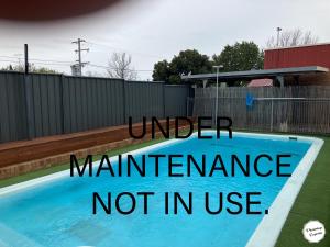 a sign that reads under maintenance not in use at Camellia Motel in Narrandera