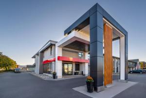 a rendering of a building in a parking lot at Comfort Inn Hamilton - Stoney Creek in Hamilton