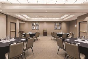 a conference room with tables and chairs and pictures on the walls at Country Inn & Suites by Radisson, Seattle-Bothell, WA in Bothell +85 photos