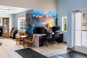 an office with a desk with a computer and chairs at Quality Inn Port Orchard in Port Orchard