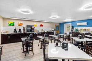 a restaurant with tables and chairs and a counter at Quality Inn Port Orchard in Port Orchard