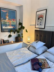 a bedroom with a bed with a pillow on it at Apartament 100m od morza in Sopot