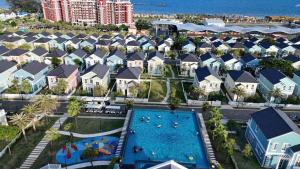 an aerial view of a resort with a swimming pool at Sunset Villa - Novaworld Phan Thiết in Bình Tú