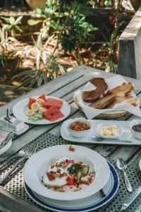 a table with plates of food on top of it at Dana Villa in Bentota