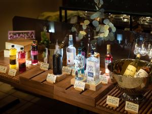 a display of bottles of alcohol on a table at Super Hotel Shinyokohama in Yokohama