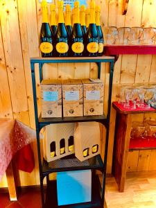 a shelf with bottles of wine in a store at Agriturismo e Alloggi Luis Gianni in Cividale del Friuli