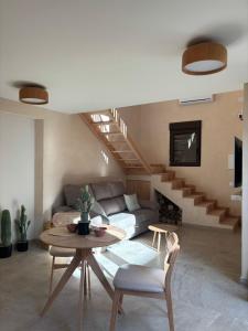 a living room with a couch and a table at Suite ideal para escapadas romanticas in Bullas +10 photos