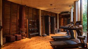 a gym with several exercise equipment in a room at Wild Coast Tented Lodge - Relais and Chateaux - All Inclusive in Yala