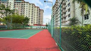 a tennis court in the middle of a city at Beachfront Bliss Sea View Glory Beach PD Homestay in Port Dickson